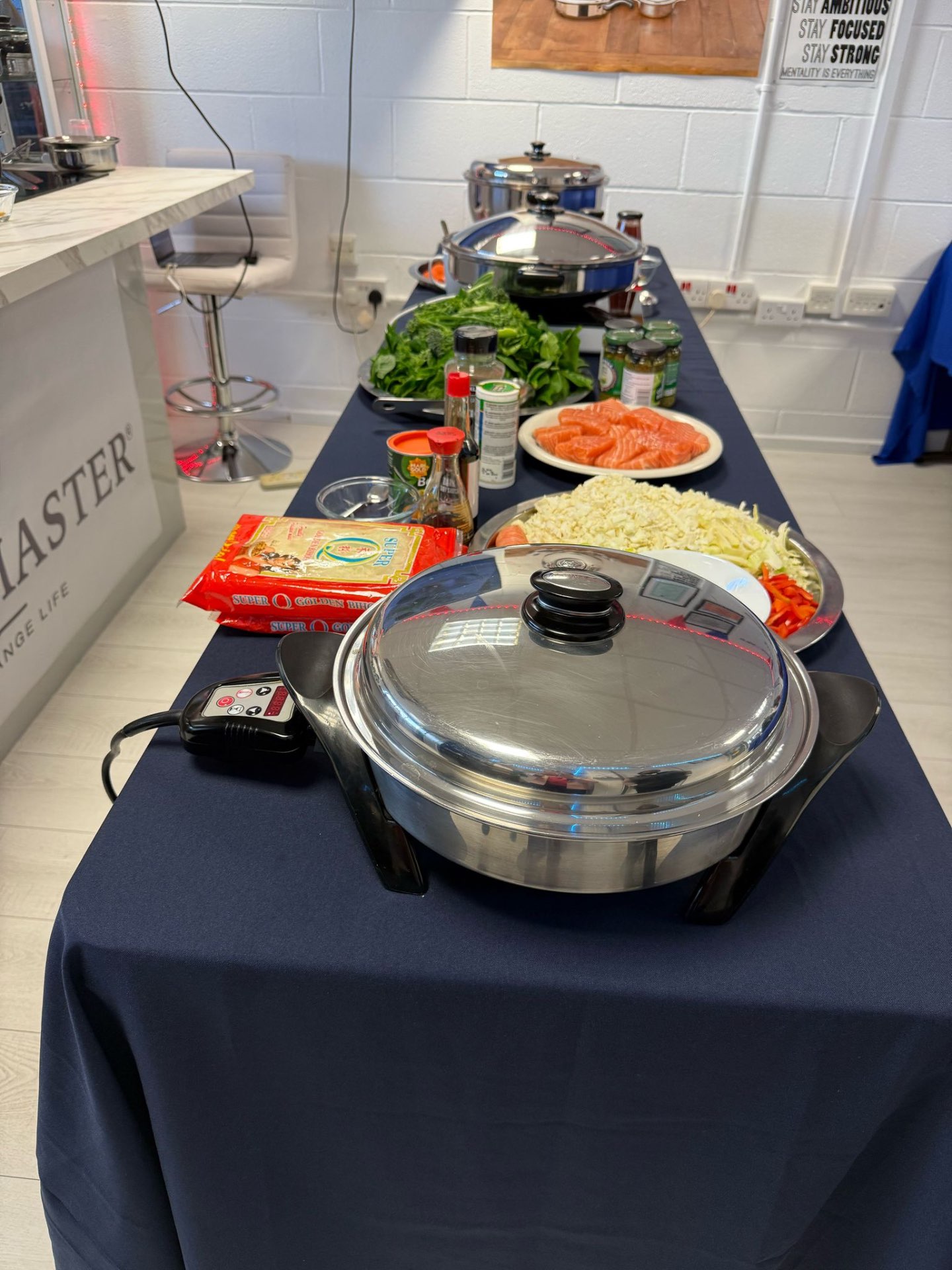 Saladmaster electric skillet set up for a live cooking show